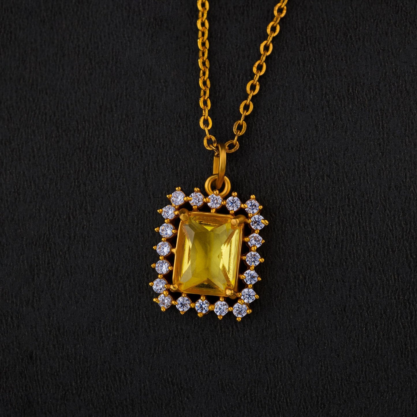 golden necklace with a two color stone