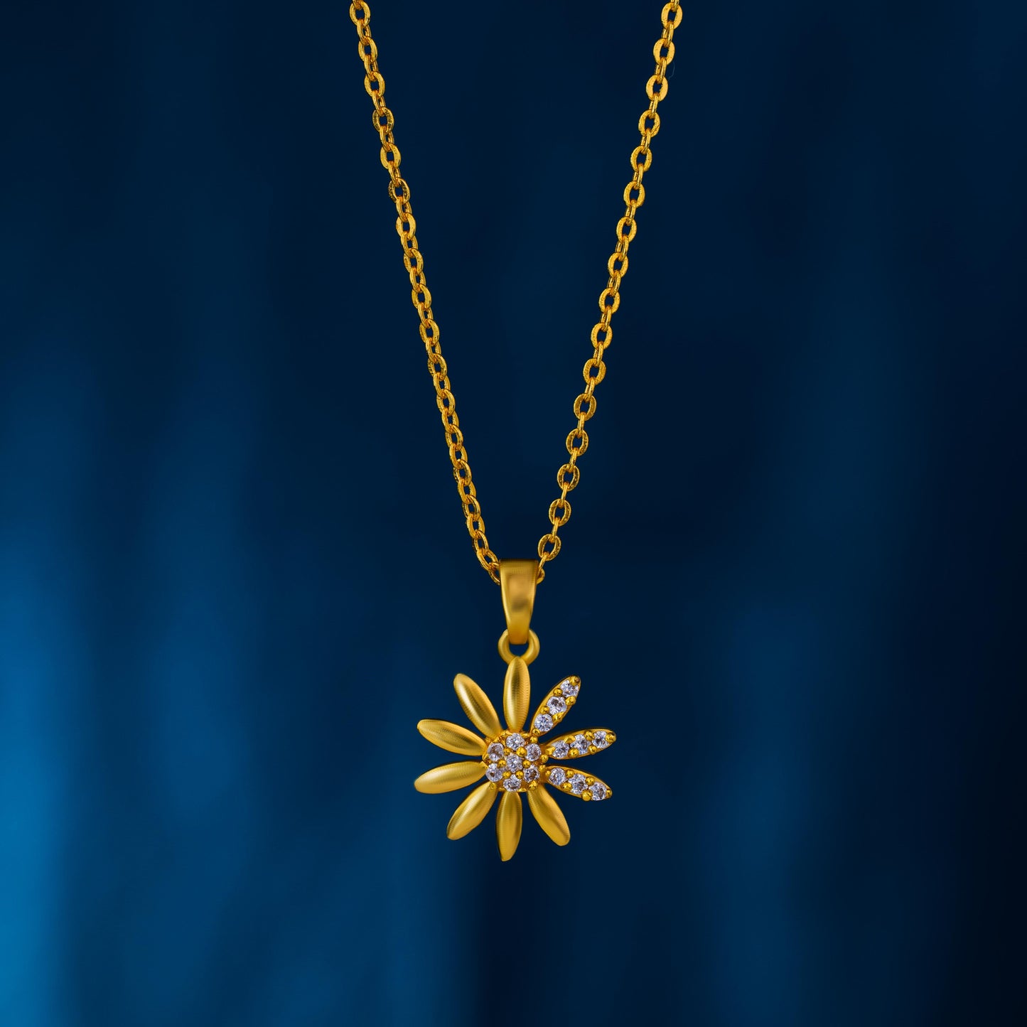 golden necklace with a flower pendant