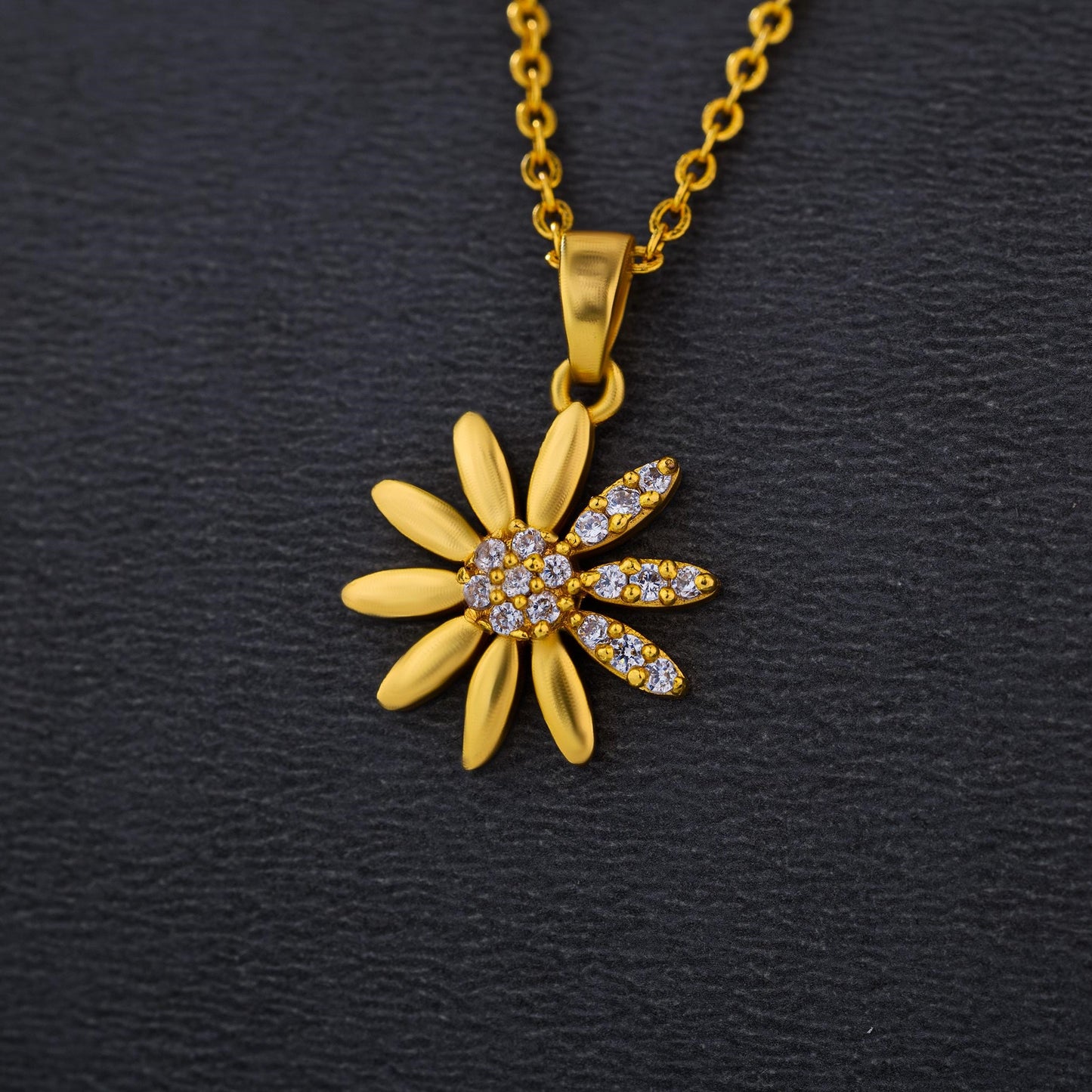 golden necklace with a flower pendant