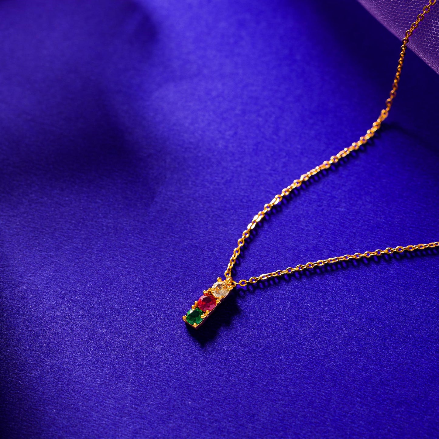 golden necklace with multicolur stones