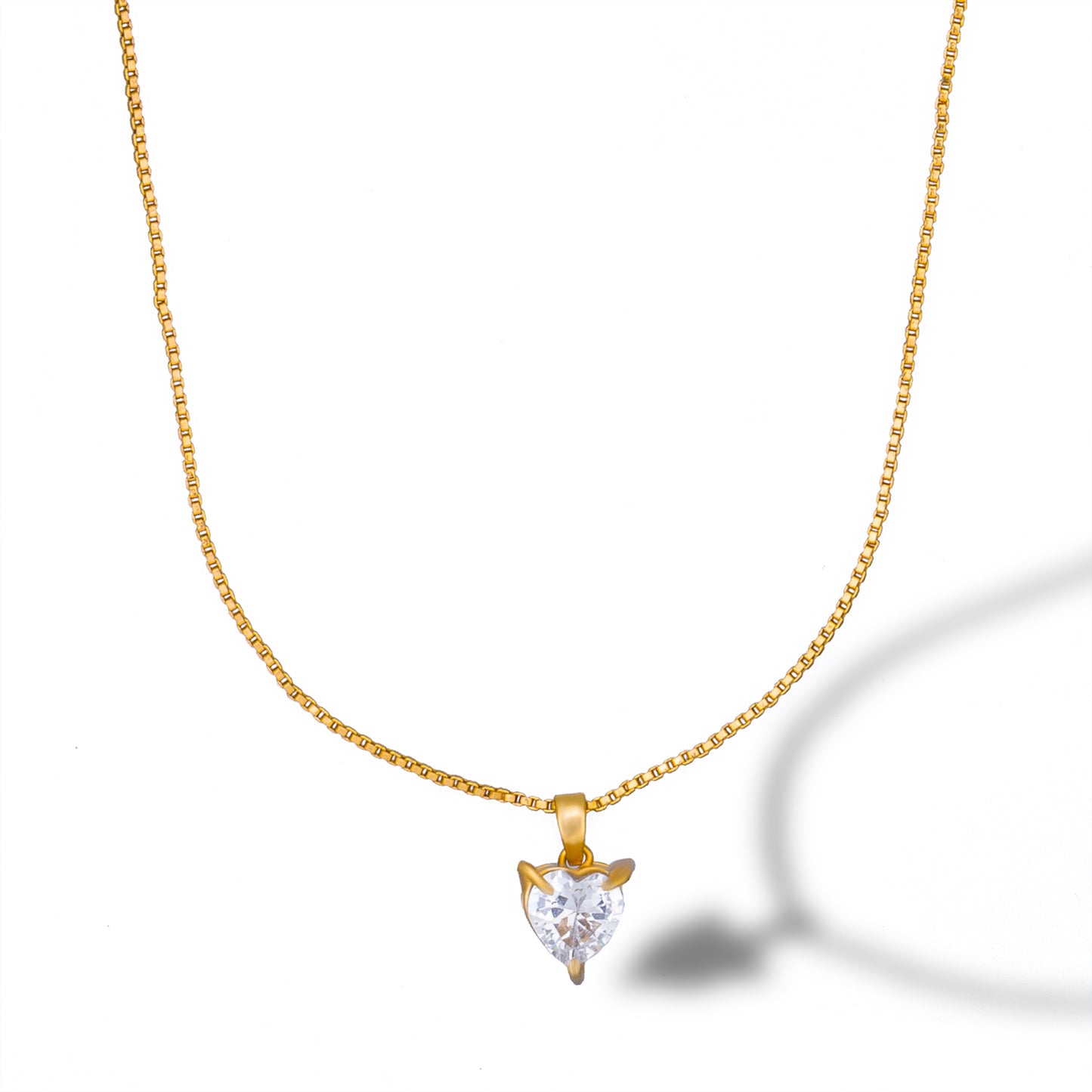 golden necklace with white heart pendant