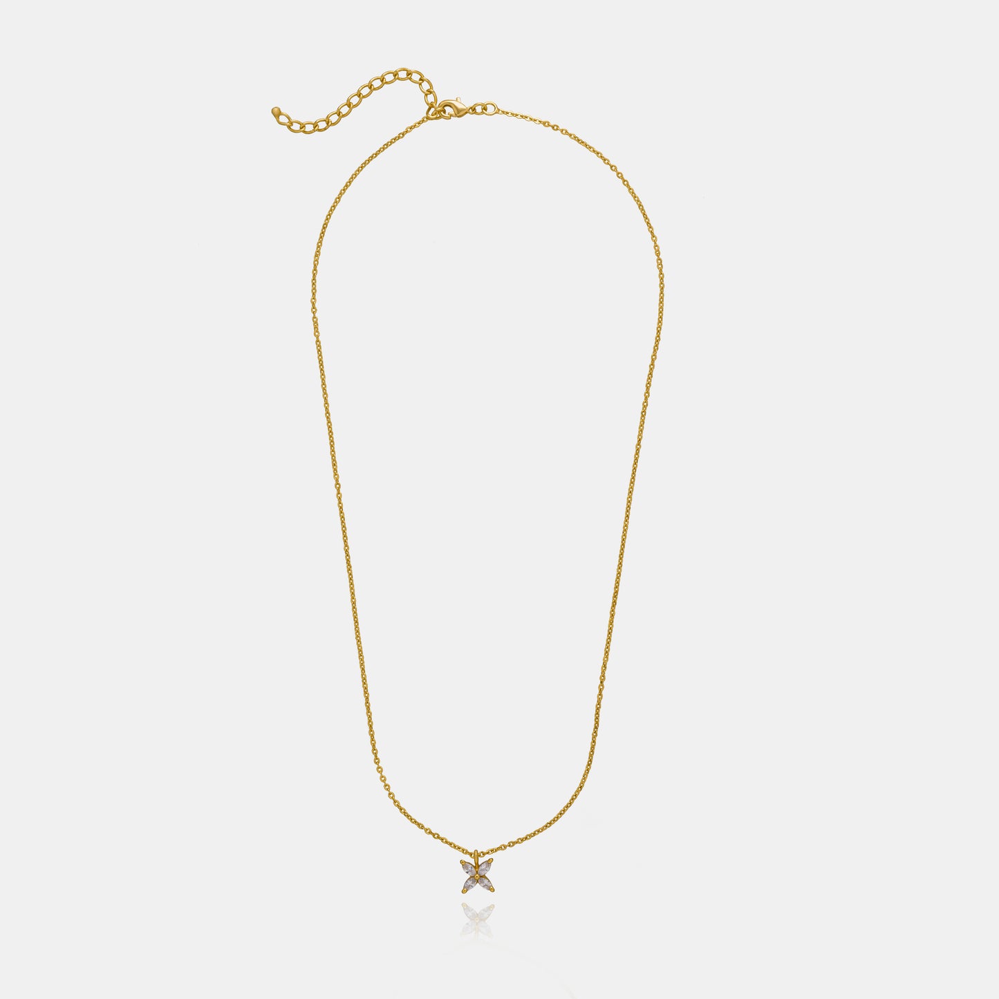 golden necklace with a small white diamond