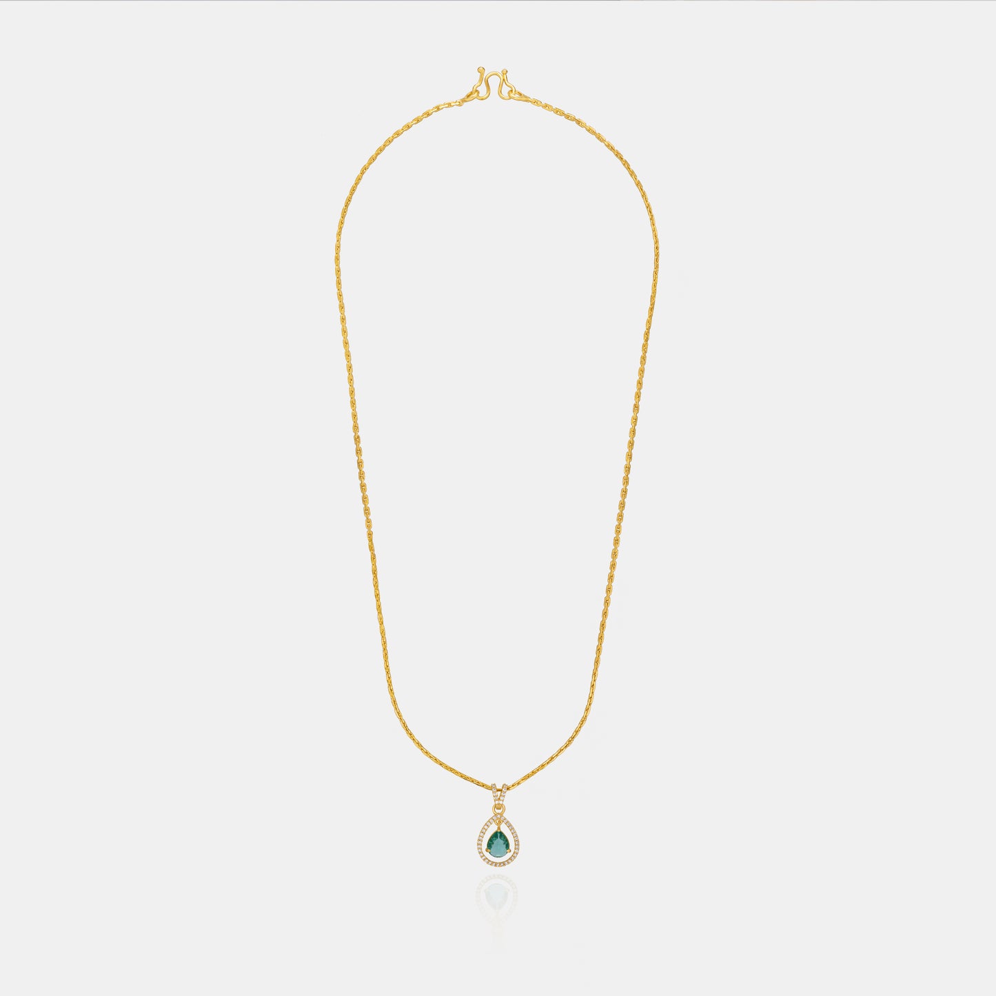 golden necklace with a stone and diamonds