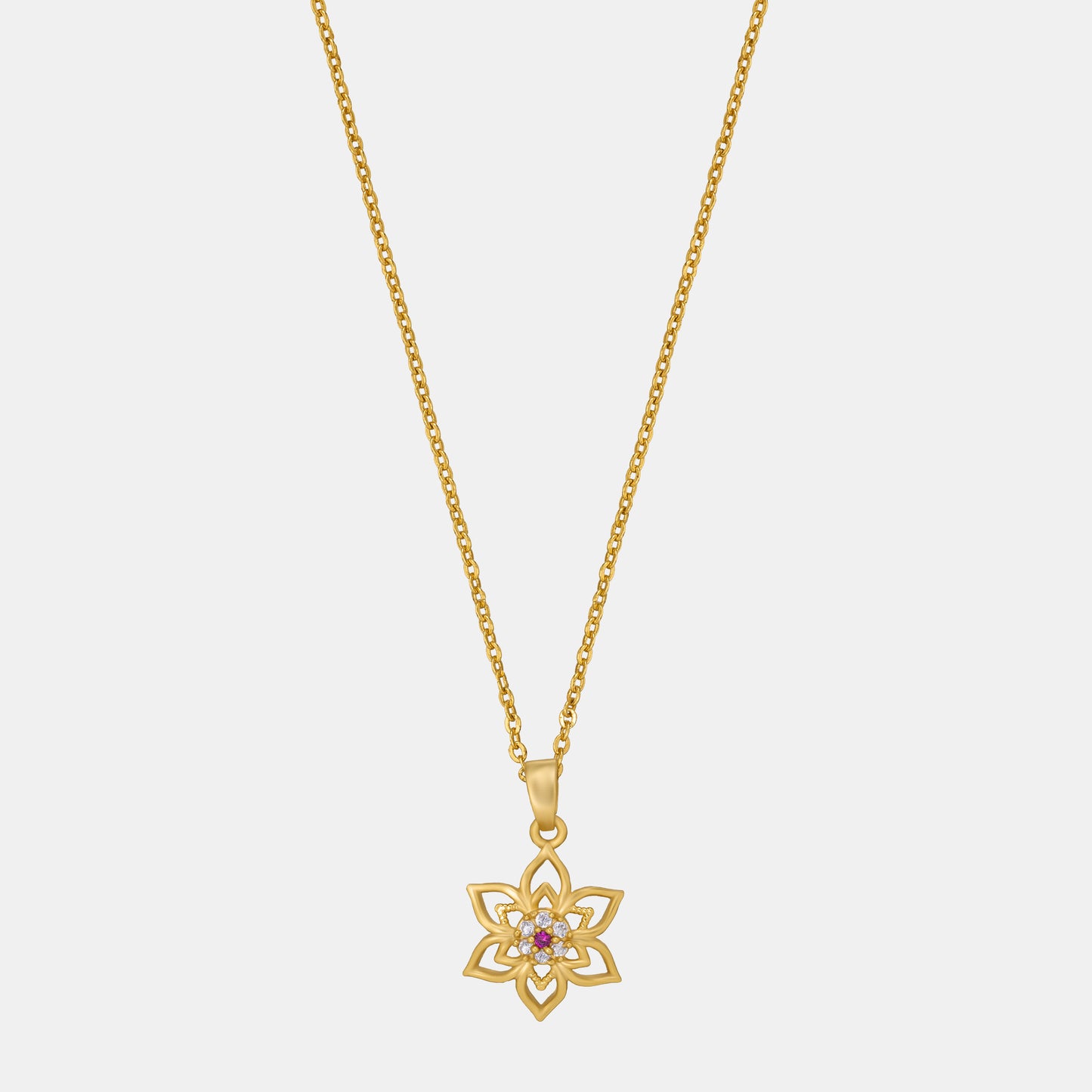 golden necklace with a flower design on it