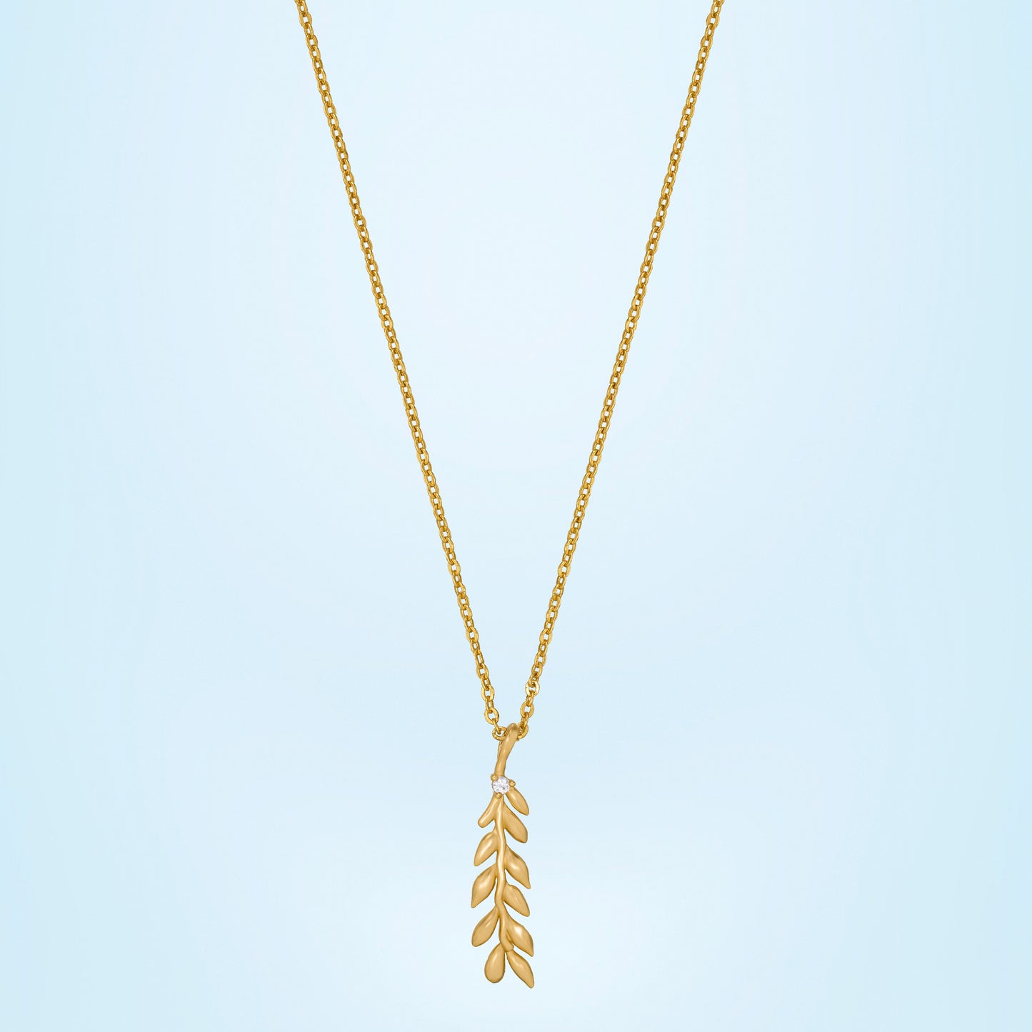 golden necklace with leaf pendant