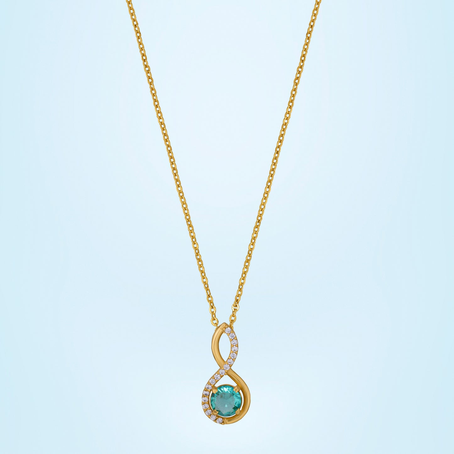 golden necklace with a stone and diamonds