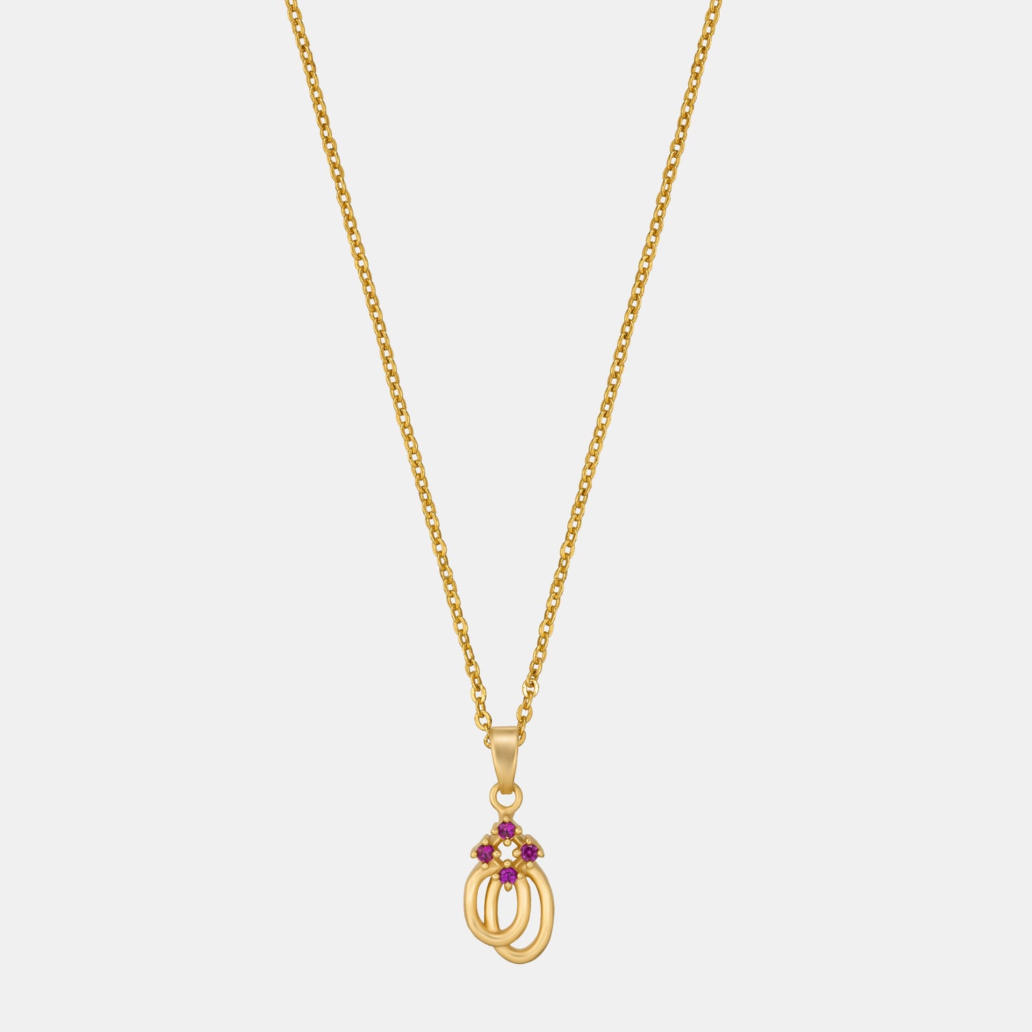 golden necklace with a red diamond pendant