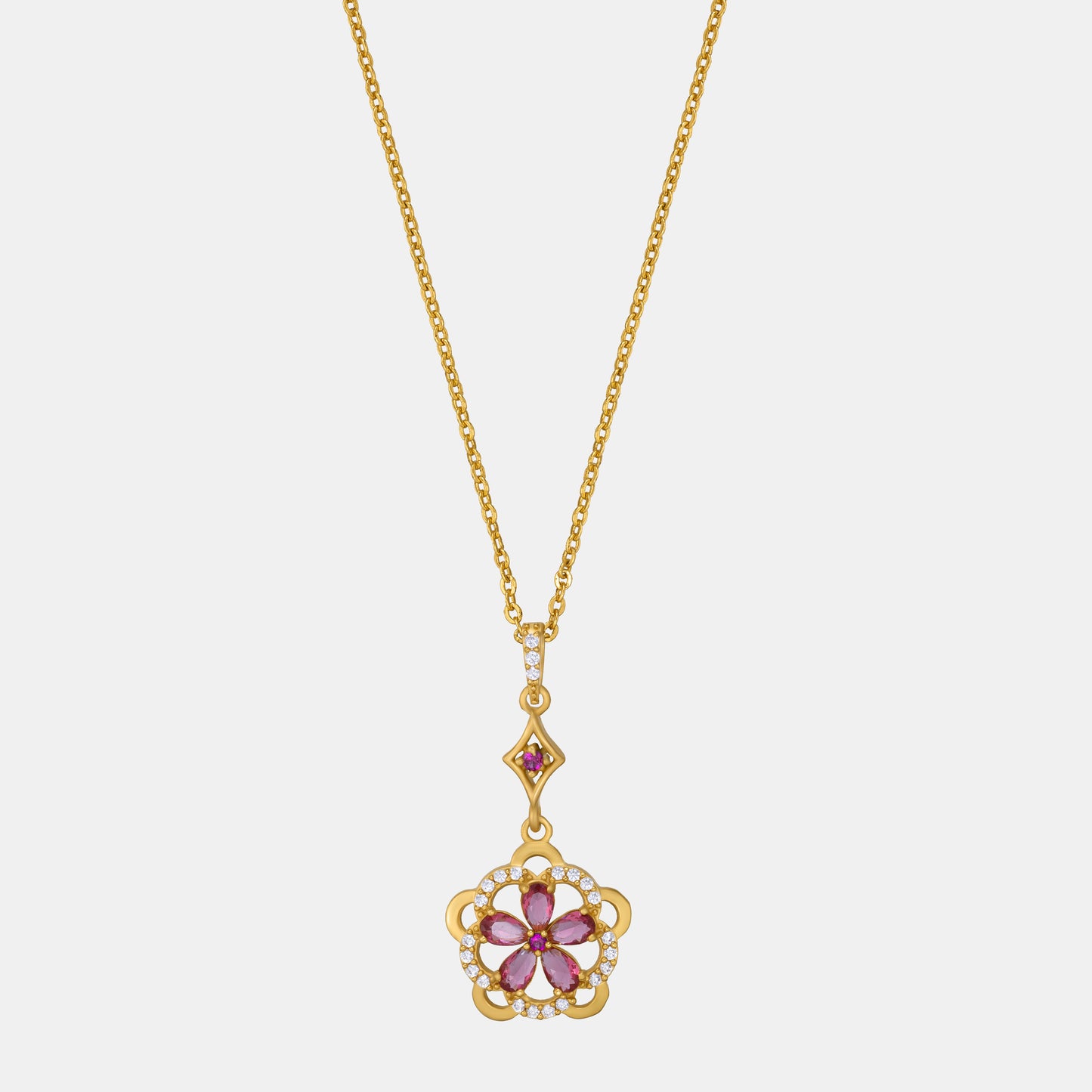 golden necklace adorned with a striking red flower pendant