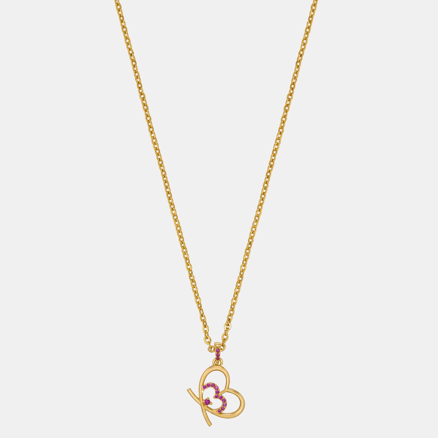 golden heart necklace adorned with pink stones