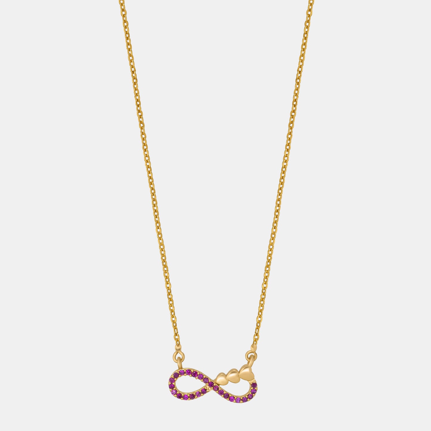 shine bright with this stunning golden necklace featuring a red infinity