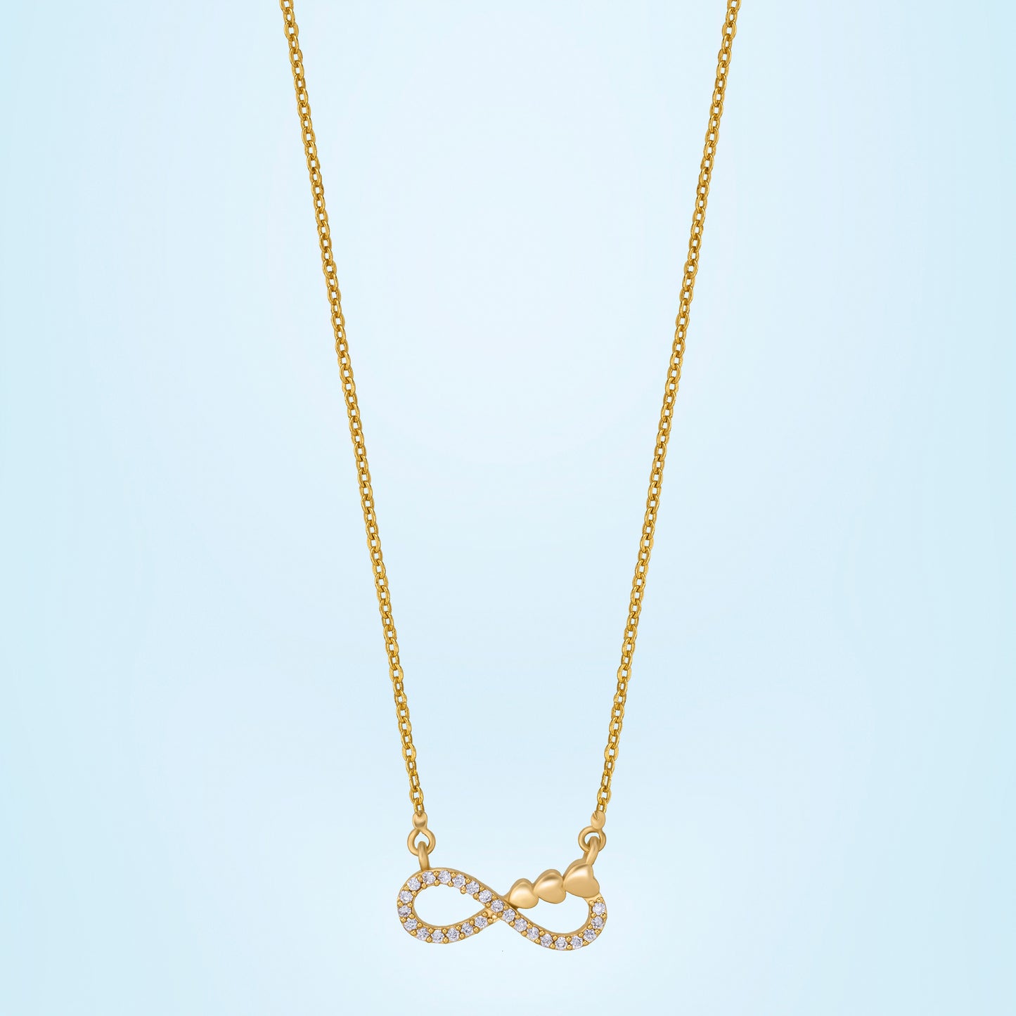 shine bright with this stunning golden necklace featuring a white infinity