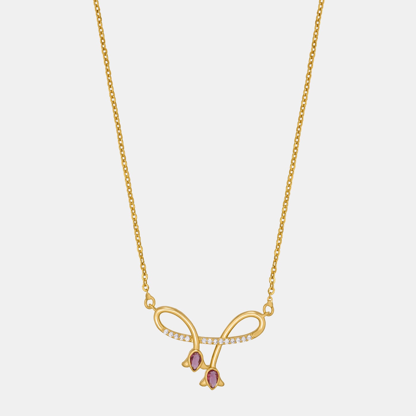 golden necklace with red stone and diamonds