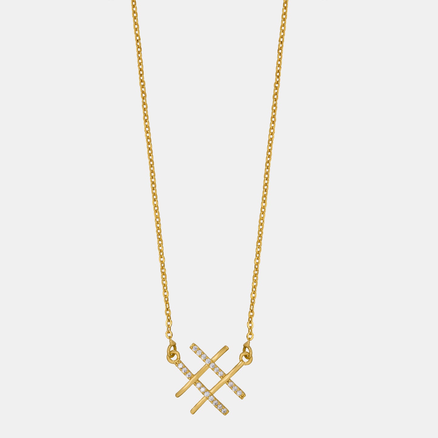 golden necklace with two crossed crosses on it