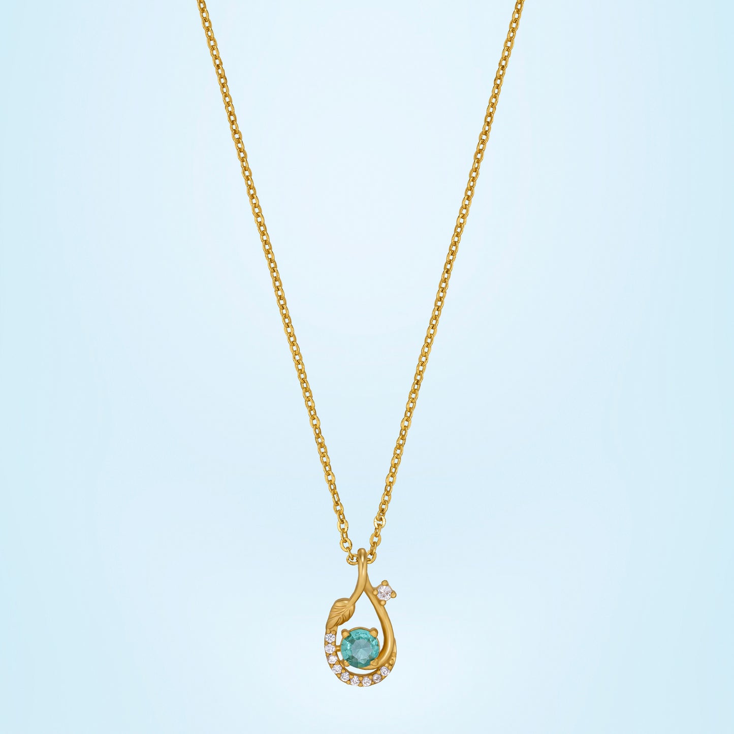 golden necklace with a stone and diamonds