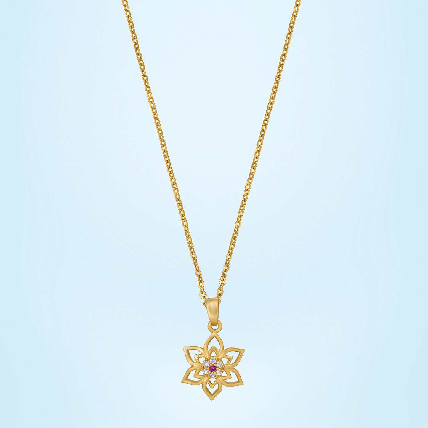 golden necklace with a flower design on it