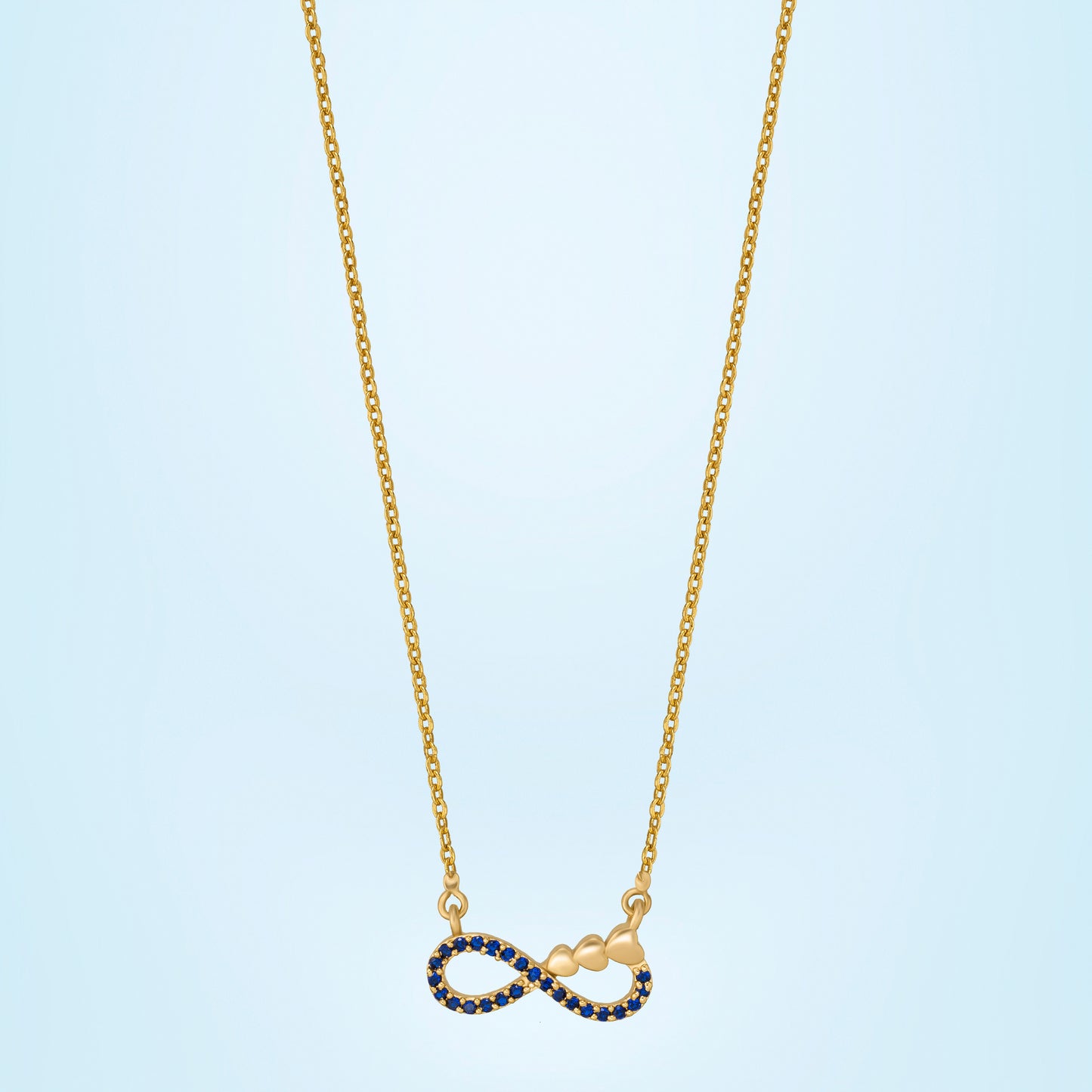 shine bright with this stunning golden necklace featuring a blue infinity