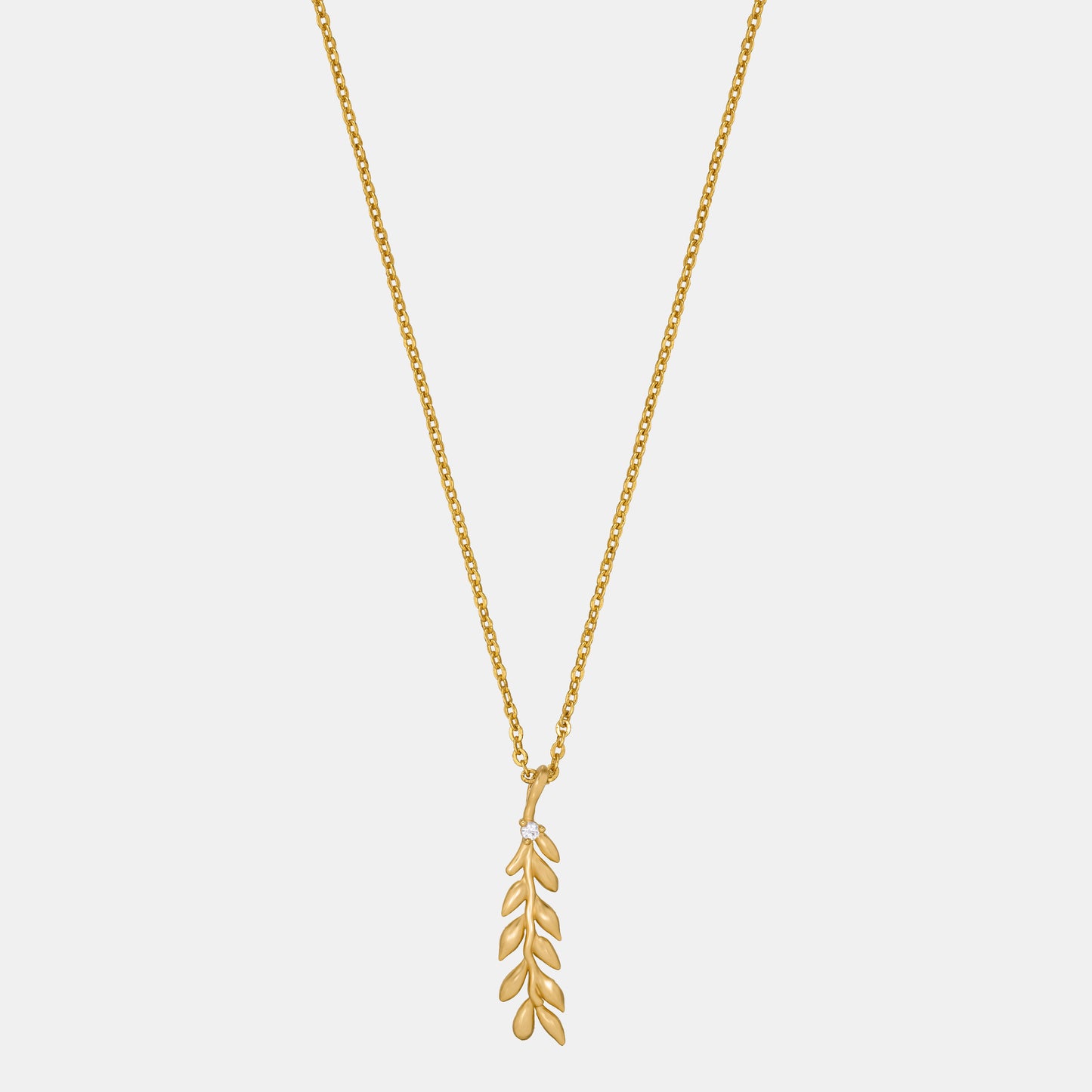 golden necklace with leaf pendant