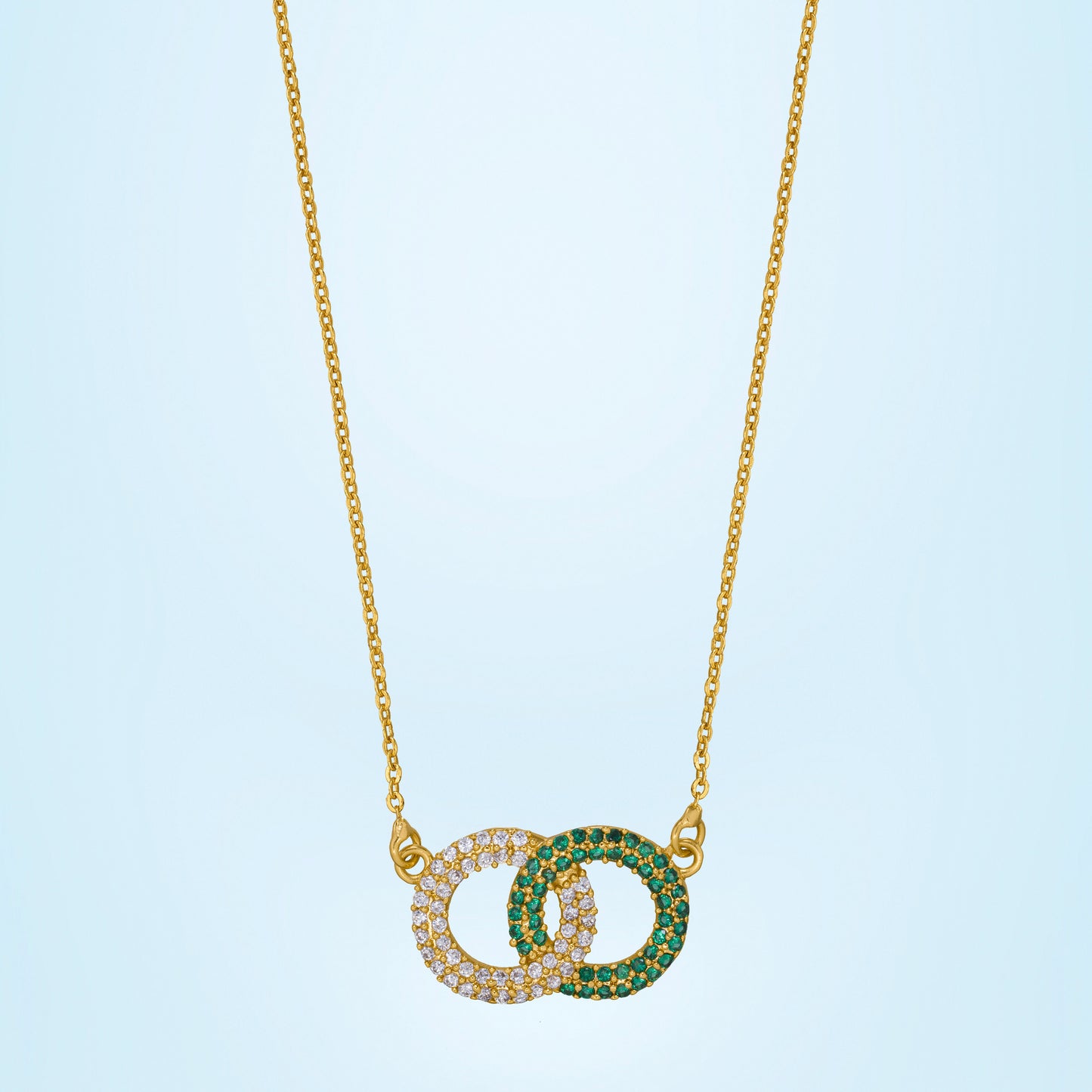 golden necklace with a diamond pendant