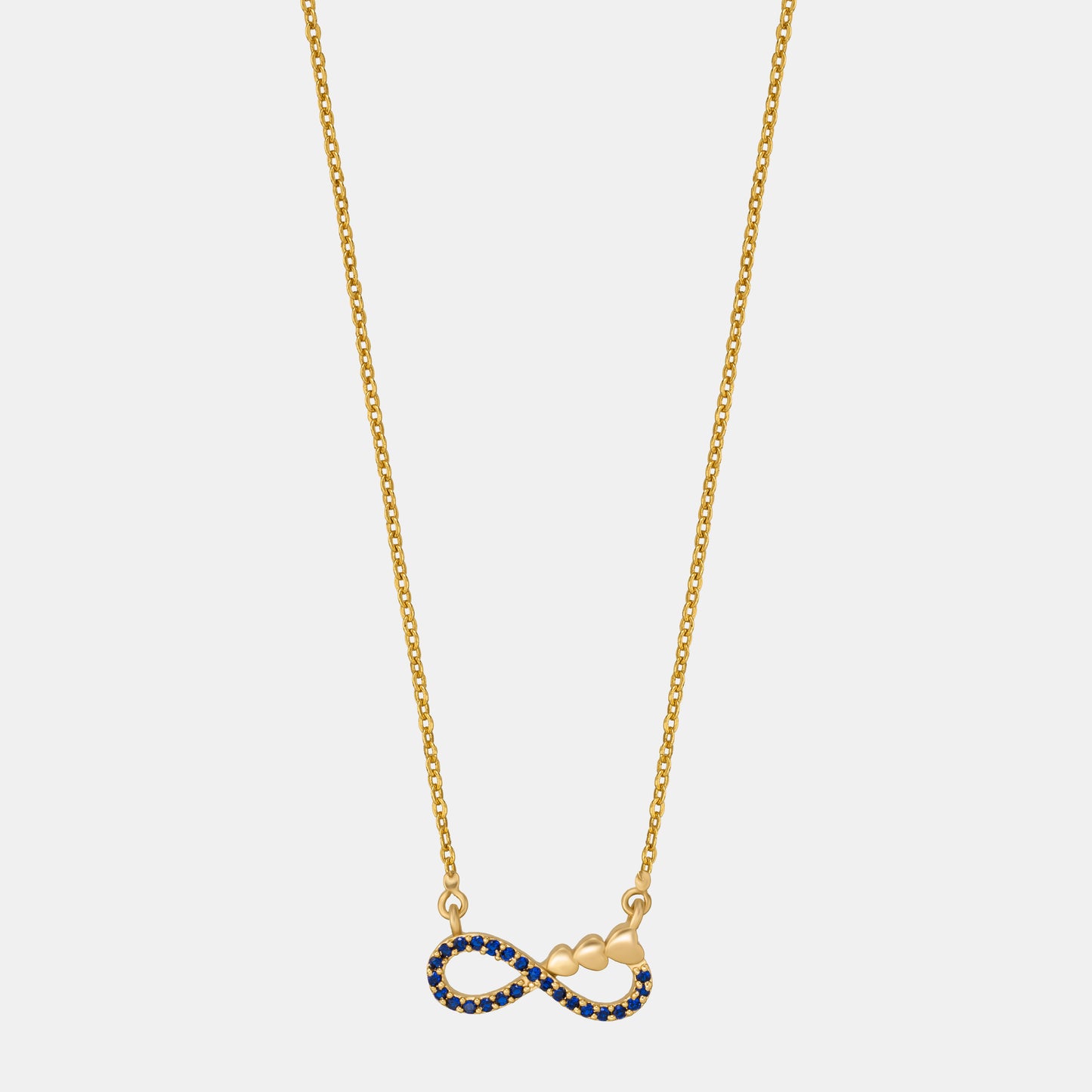 shine bright with this stunning golden necklace featuring a blue infinity