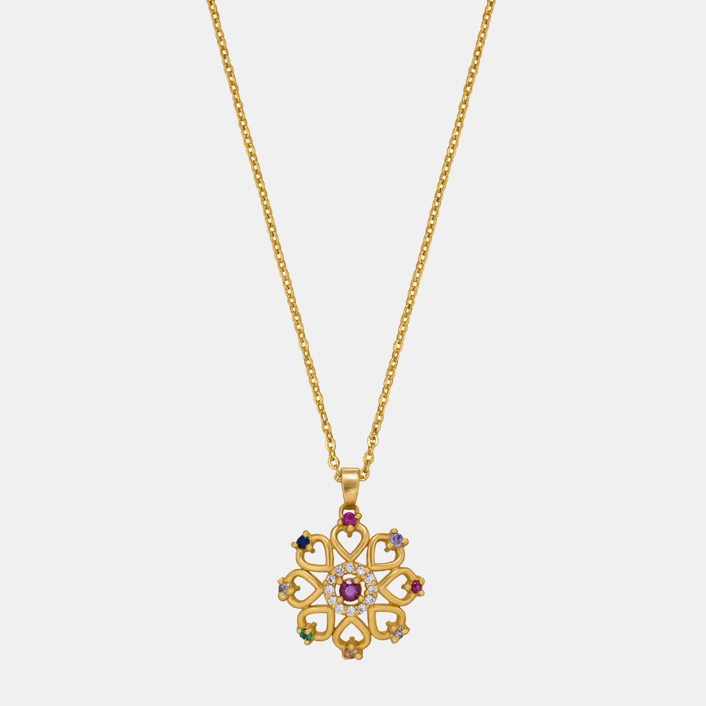 golden necklace with a flower design and multi colored stones