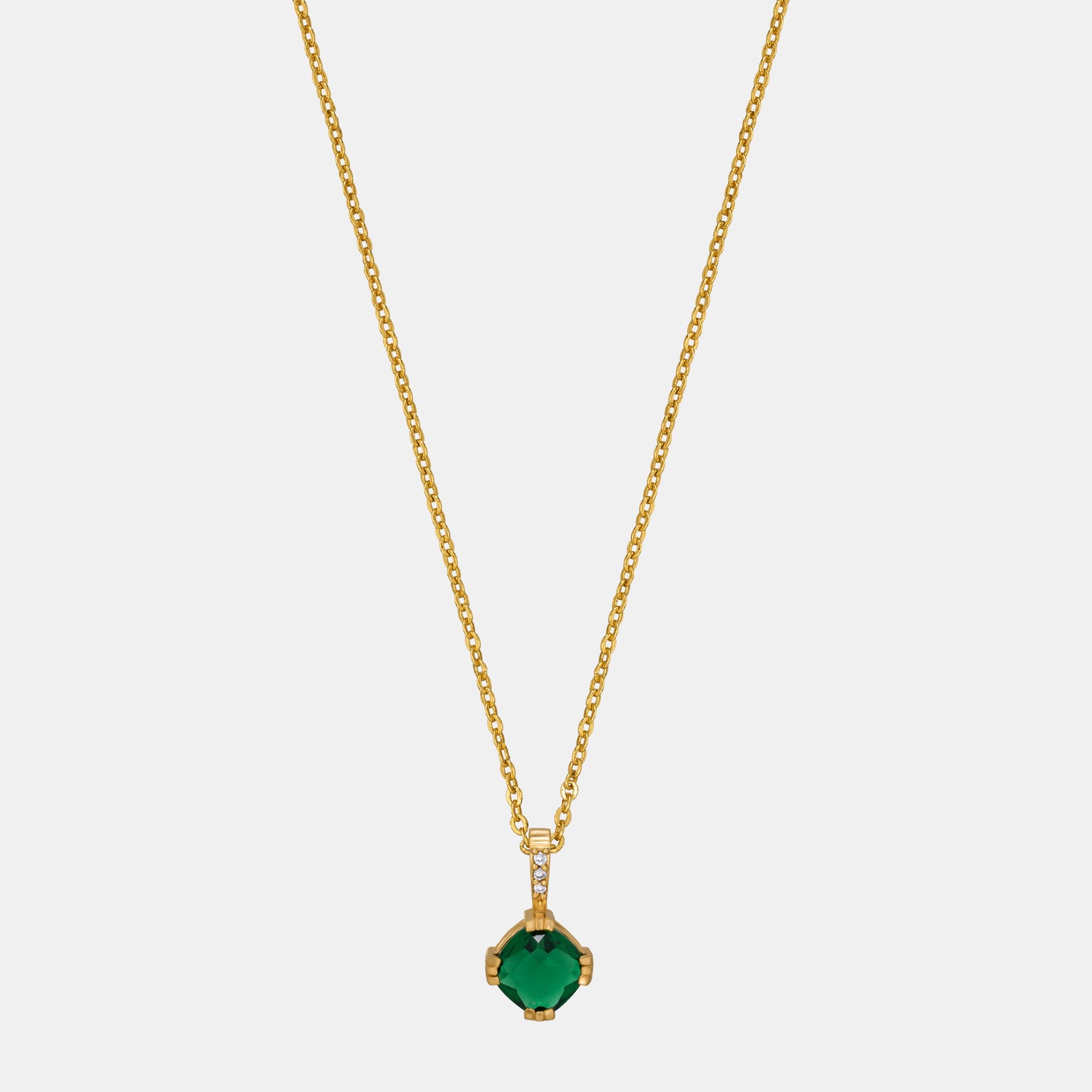 golden necklace with a stone