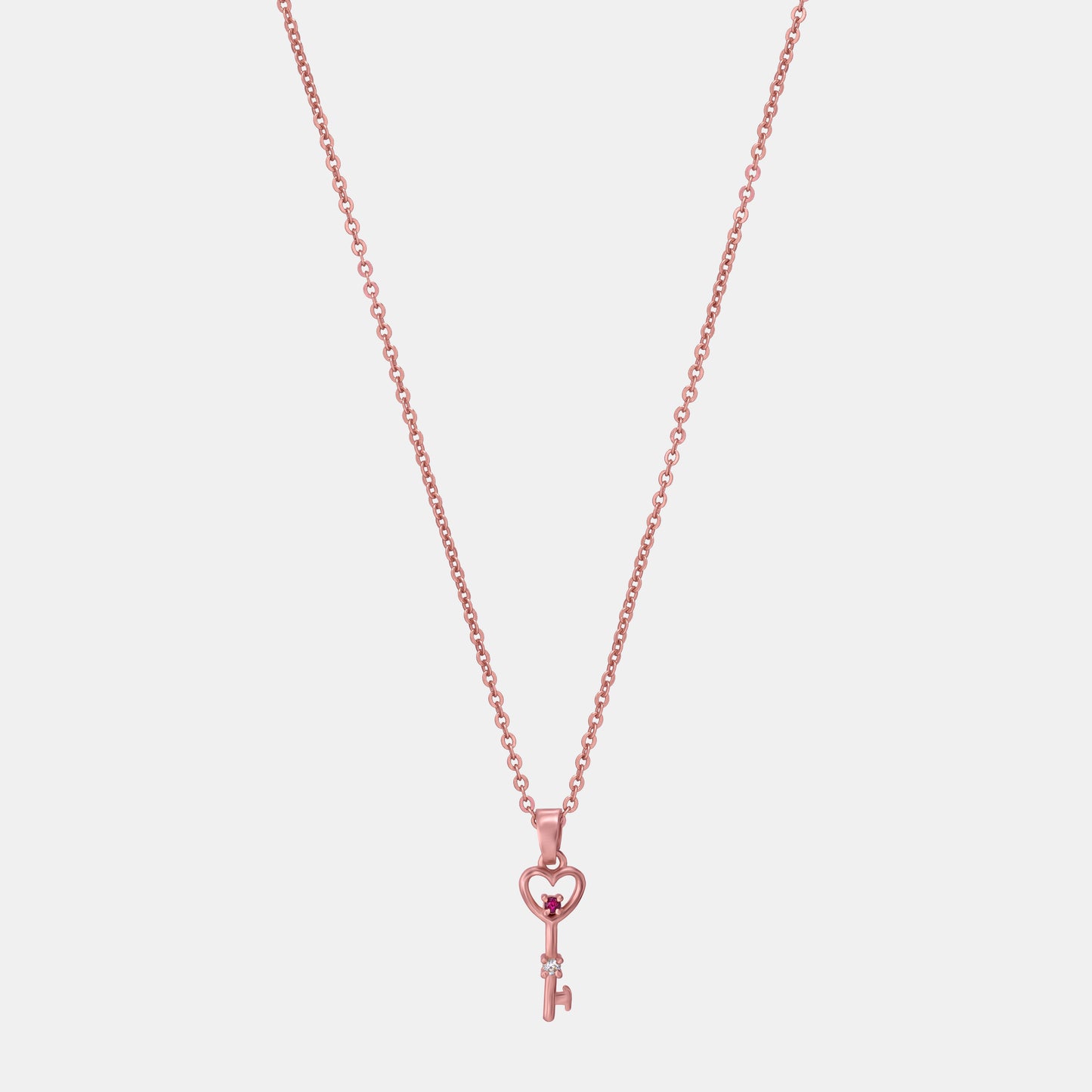 rose gold necklace with a heart and a key