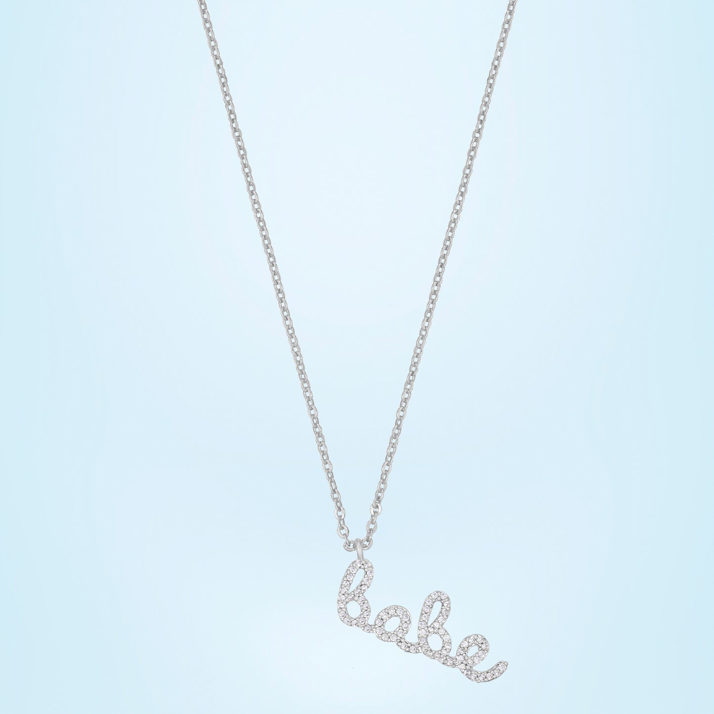 silver necklace with the word love on it