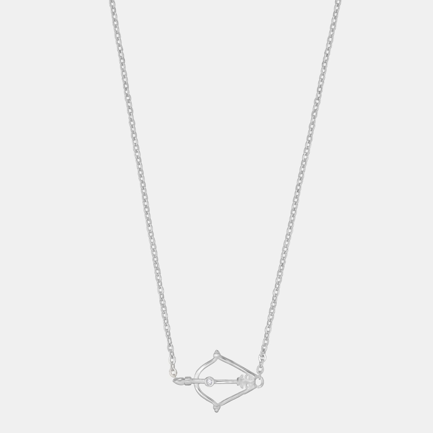 silver necklace with a small arrow on it