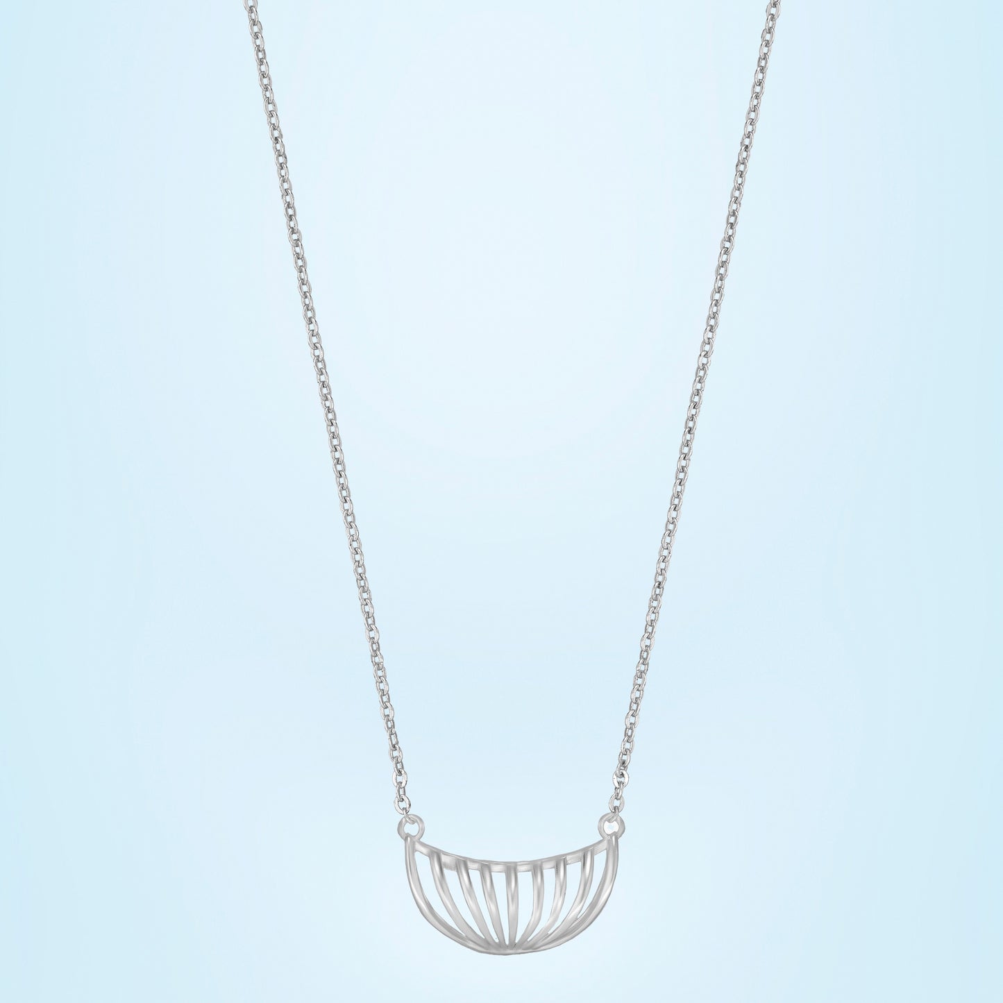 silver necklace with a large curved design