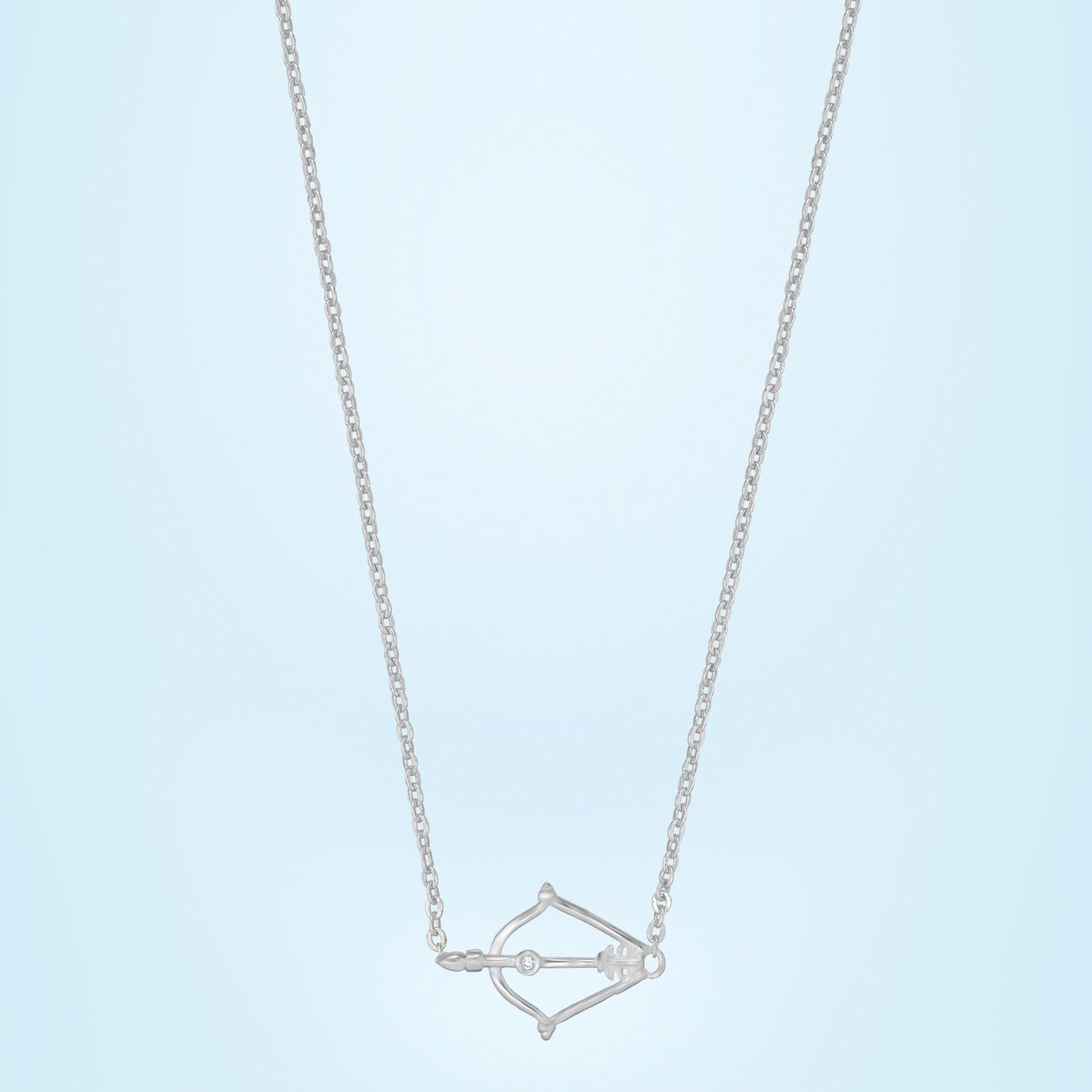 silver necklace with a small arrow on it