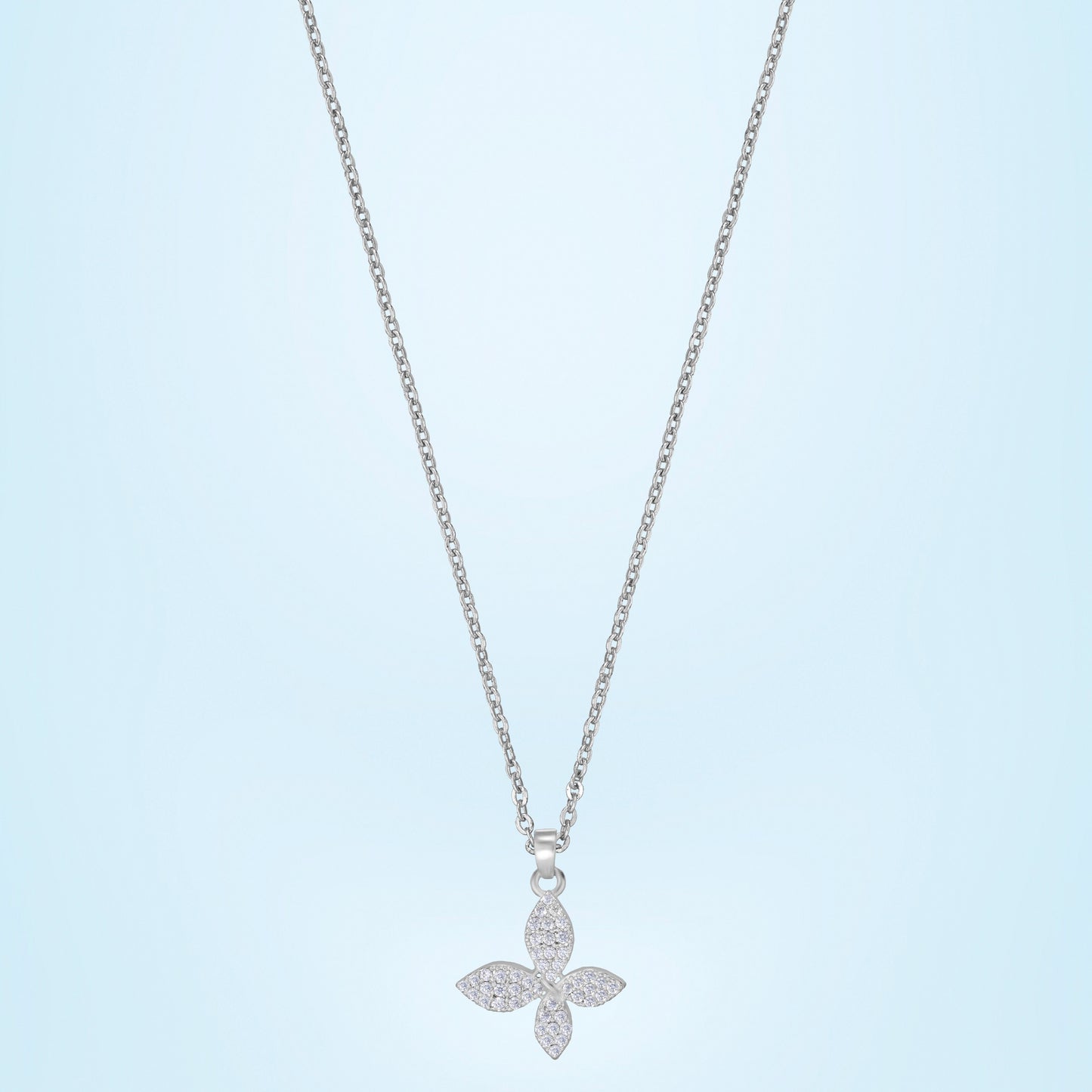 silver necklace with a diamond butterfly pendant