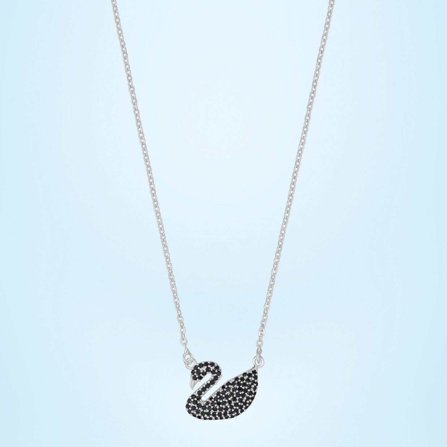 silver necklace with a stone swan