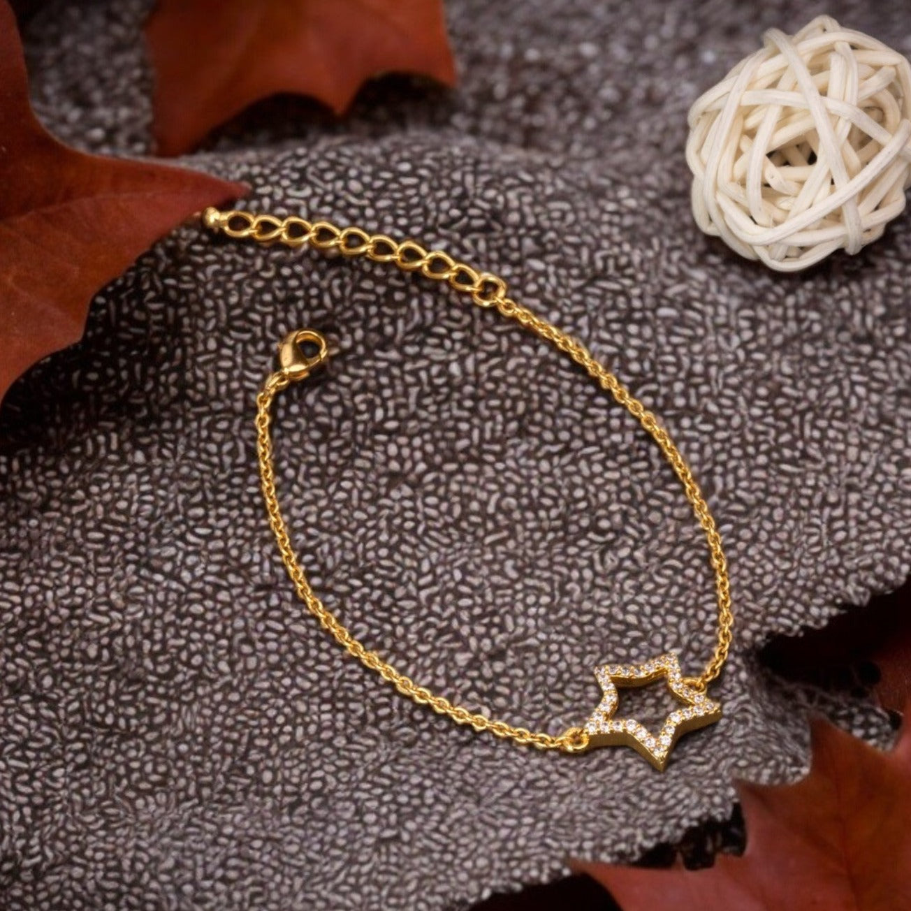 golden bracelet with a star charm