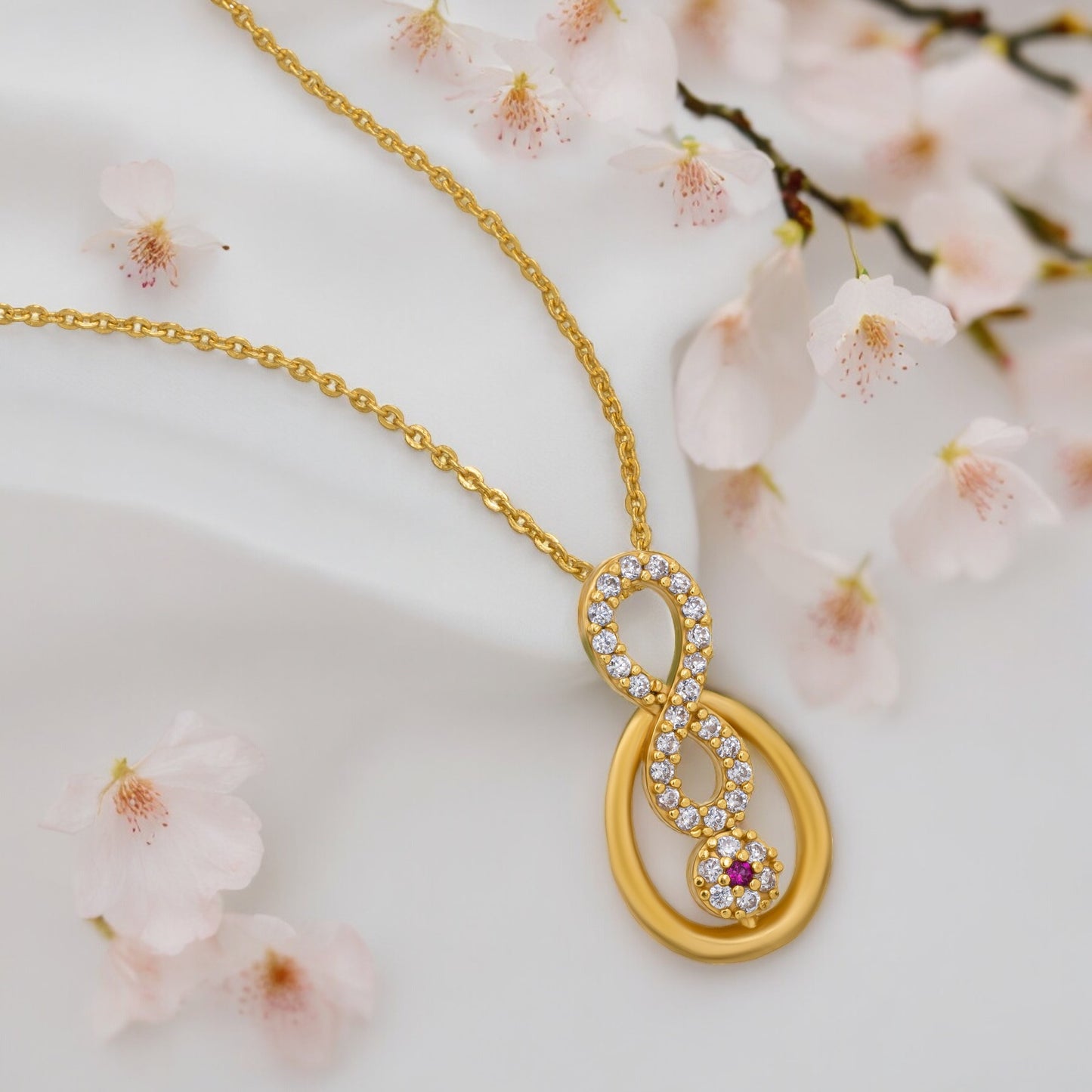 golden necklace with a diamond pendant