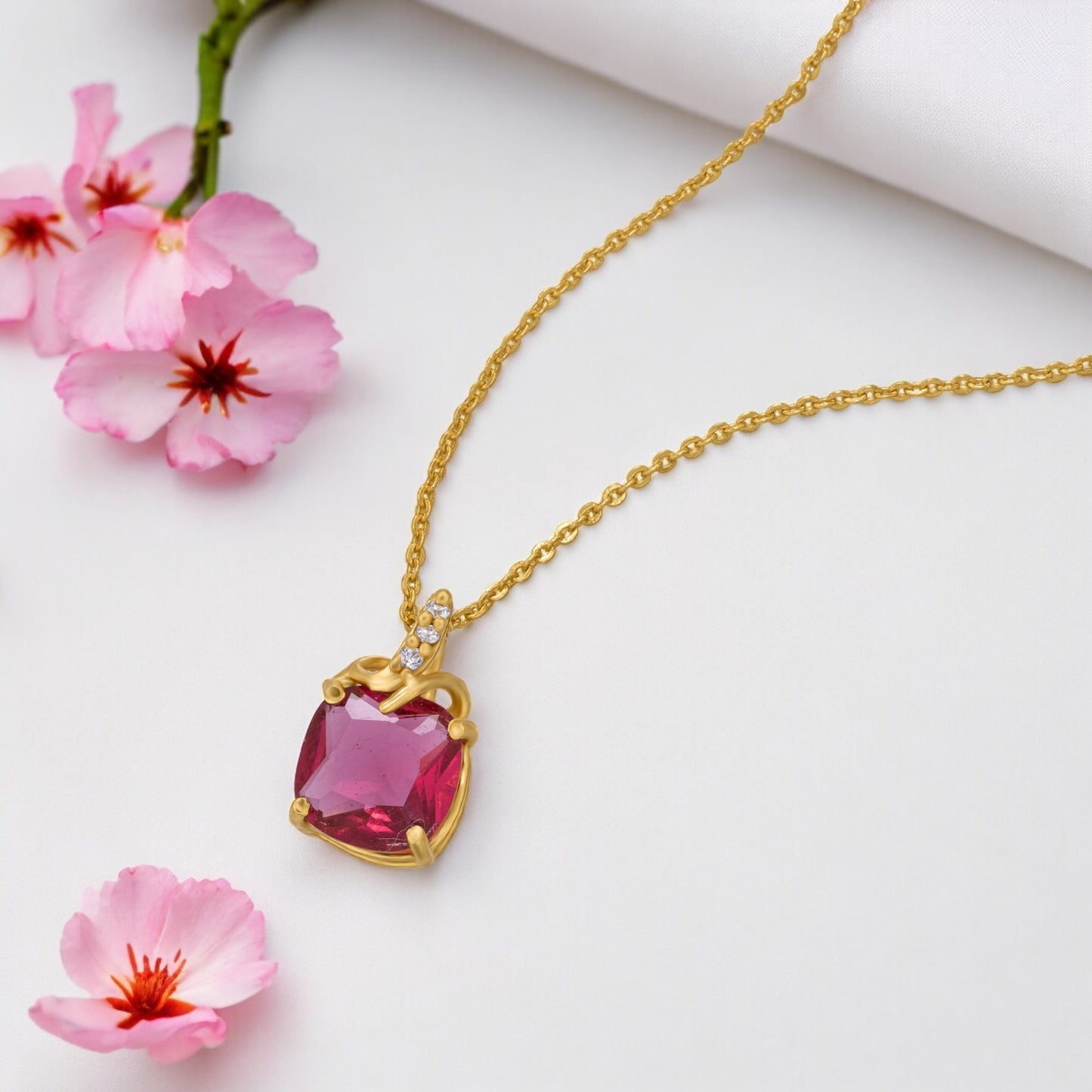 golden necklace with a sapphire stone